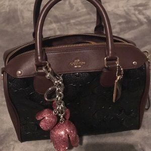 Black and burgundy coach hand bag